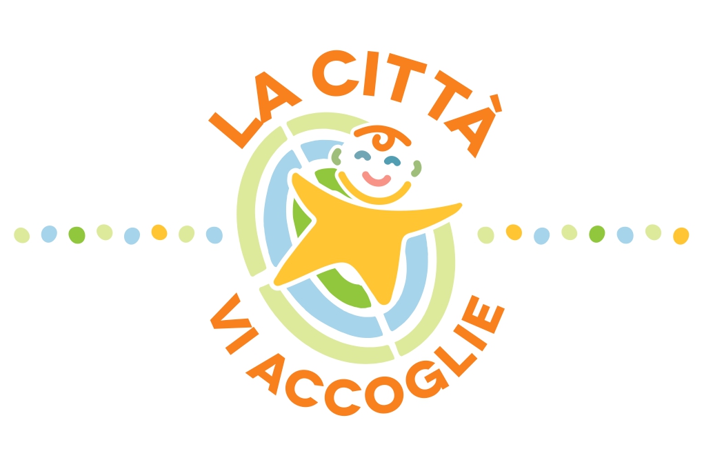 Figurata di neonato stilizzato all'interno di una culla che ricorda Prato Della Valle e circondato dalla scritta "La città vi accoglie"